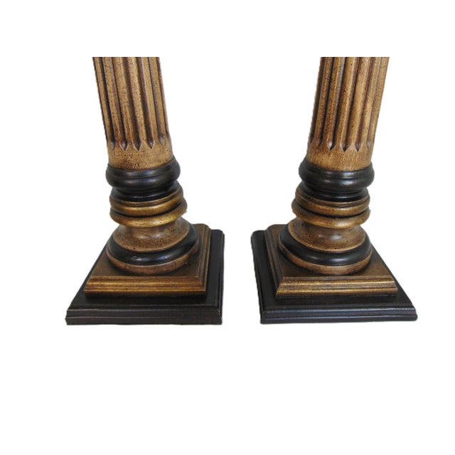 A pair of hand painted fluted column lamps. Lamps are 33" high (base to top of finial), 27" high (base to top of socket)....