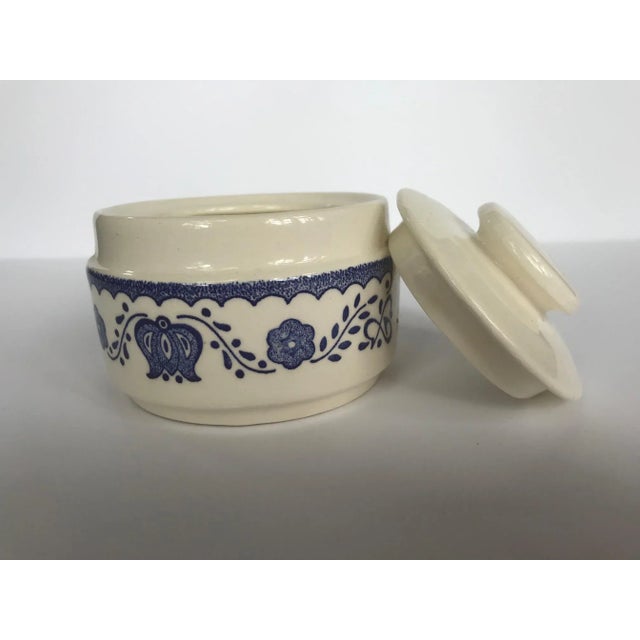 Vintage white ceramic lidded dish with simple cobalt blue flower design. Lid has an oversized button handle. Would be cute...