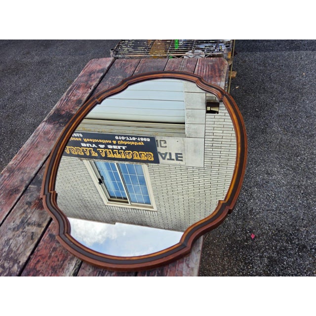 The 1930 Oval Walnut Hand Painted American Mirror is a unique and antique piece that exudes vintage charm. This vertical...