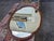 The 1930 Oval Walnut Hand Painted American Mirror is a unique and antique piece that exudes vintage charm. This vertical...