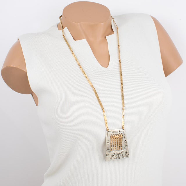 This amazing artisan studio modernist brass and silvered metal link necklace was created in the 1960s. The piece features...