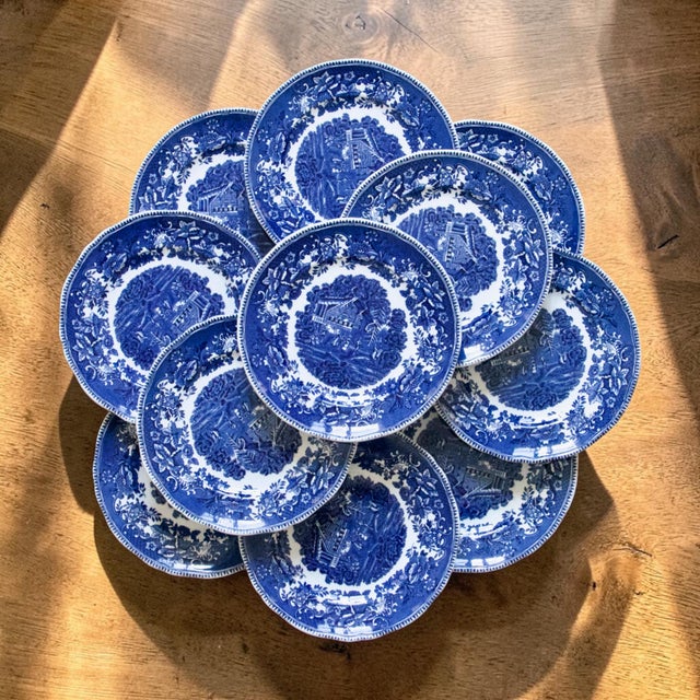 Set of 11 very pretty vintage dessert plates by Enoch Wedgwood, from the “Avon Cottage” collection. Hand-engraved in a...