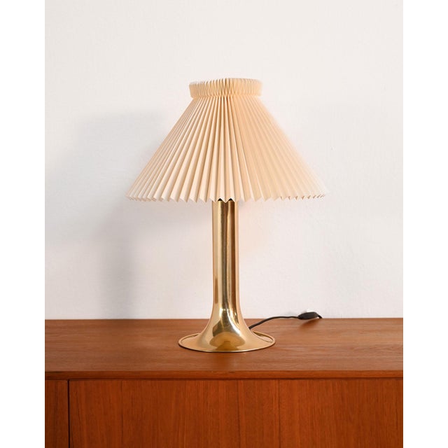 Danish table lamp, produced by HEMI in the 1960s, with a gold-plated metal frame and an ivory-colored pleated lampshade....