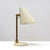 Wonderful early desk lamp model 5305 by Paavo Tynell for Taito, Finland, with a large articulate crème colored enameled...
