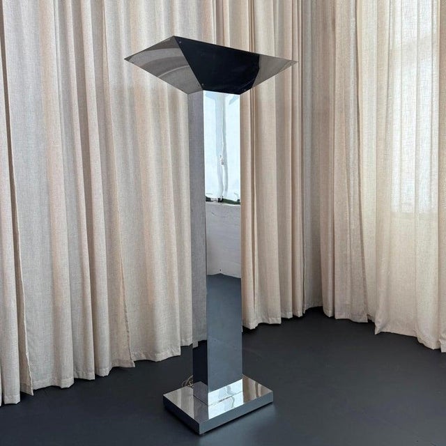 This tall, striking mirror finish chrome skyscraper or monolith floor lamp embodies the bold, geometric minimalism of...