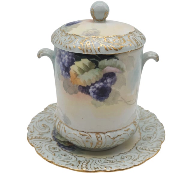 A delicate vessel from another century, this Limoges porcelain whispers refinement. Hand painted clusters of blackberries...