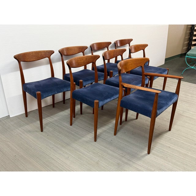 Design Plus Gallery presents a Set of Eight Danish Mid 20th Century Modern Dining Chairs designed by Arne Hovmand-Olsen...