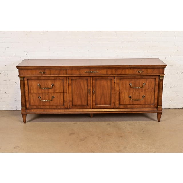 A gorgeous French Regency Louis XVI style nine-drawer dresser or credenza By J.L. Metz Furniture Co. USA, 1960s Carved...
