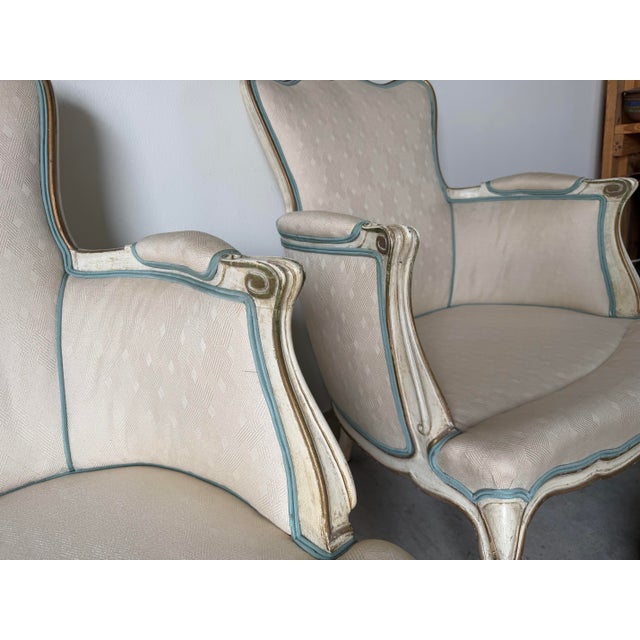 Pair of Vintage Hollywood Regency French Louis XV-Style Painted & Gilt Bergère Lounge Armchairs For Sale - Image 4 of 12