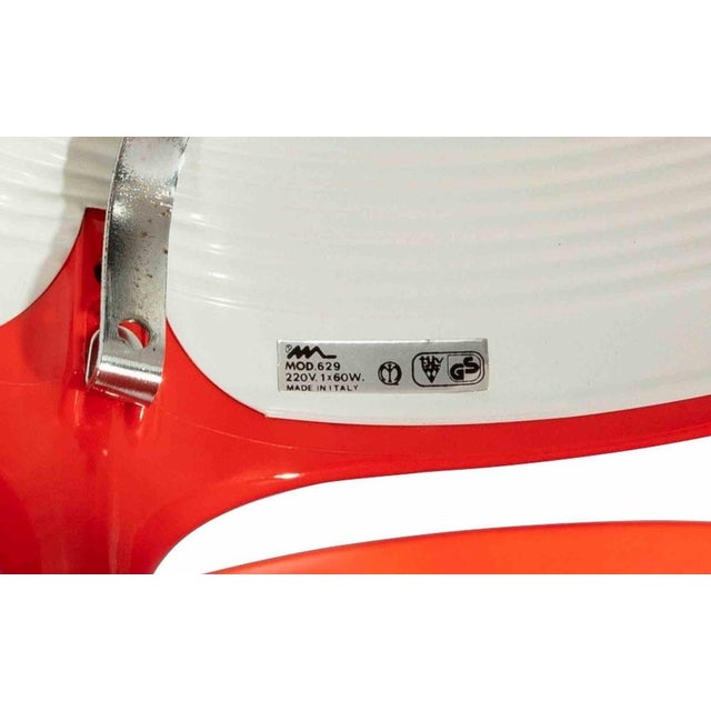 Table Lamp is a "Red Cobra" model, by Elio Martinelli, in the 1960s. Table lamp with structure in moulded ABS in shades of...