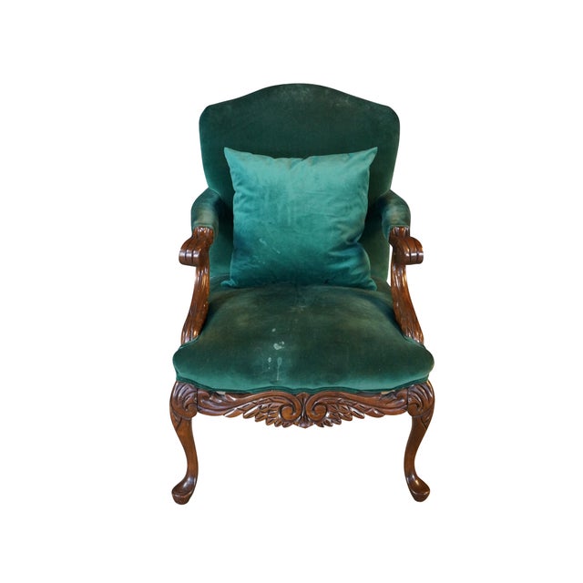 This Victorian Revival armchair showcases ornate, stately craftsmanship, featuring a beautifully carved solid mahogany...