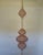 A striking monumental handwoven copper wire hanging sculpture in the style of Ruth Asawa, showcasing the delicate...