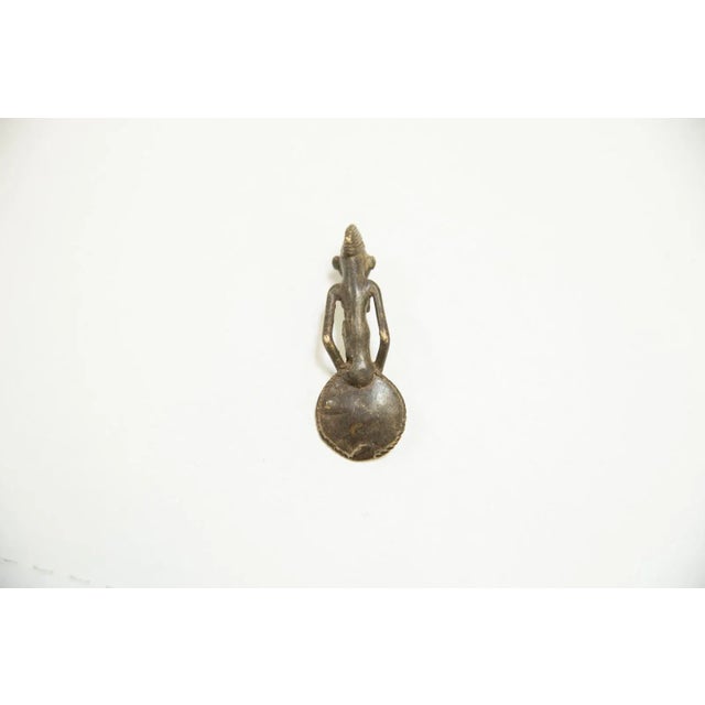 :: Vintage circa mid 20th century African bronze casting of a woman in the shape of a spoon! This is such a unique piece,...