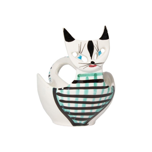 A ceramic bowl by Bitossi. Made in Italy, this bowl is in the form of a white cat with black ears and a checkered design...