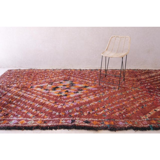 Elevate your space with this high quality Moroccan Collector Rug. Measuring 14.1 x 6.5 ft, this wool rug is not only a...