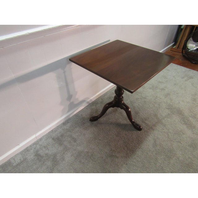 Item: 86511: Kittinger Williamsburg Adaptation Solid Mahogany Lamp Table. Age: 1960's. Details: Pedestal base. Condition:...