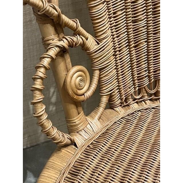 An elaborately hand-woven fanback culminates in an extra-high, dramatic headrest that hints at a flower in bloom, with a...