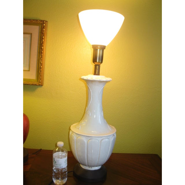 The color and embossed flowers, large daisy petals on the surface of this lamp make it hard to resist. The lampshade glass...