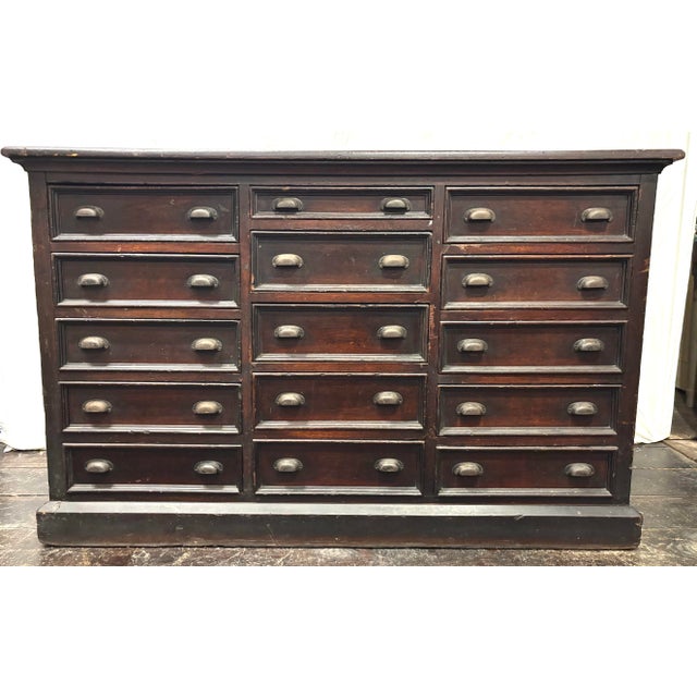 Circa 1900 - 15 Drawer Store Counter. All original including hardware and surface. Original paneling on all three sides....