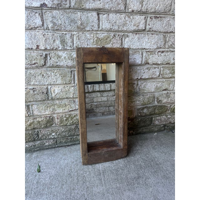 Rustic wooden mirror, wall hung. The mirror is set 2.5" deep into the rustic wooden frame, which has a hanging mechanism...