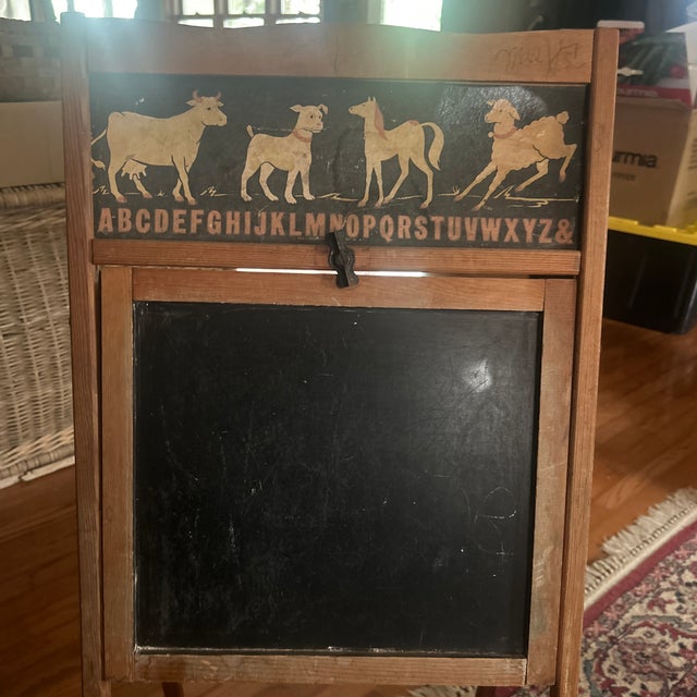 Measures 17”x39”; converts from a chalkboard to a desk; marked 1951 Transogram Co. all original; cardboard insert with...