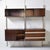 A two-module Urio bookcase designed for MIM Roma in the 1960s. The two modules consist of three storage units and a teak...