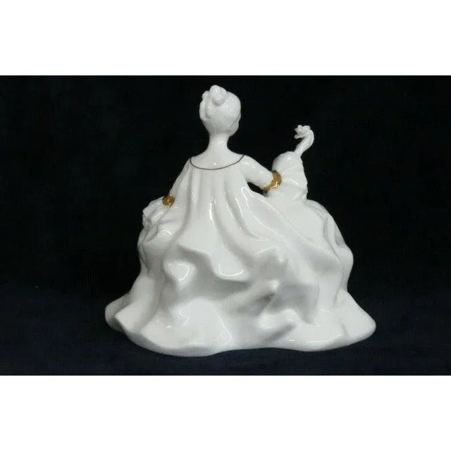 This charming figurine is made of bone china / porcelain. This beautiful porcelain doll has the title " Antoinette " with...