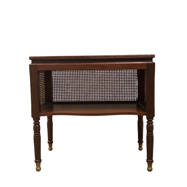 Milling Road by Baker Furniture mahogany console table featuring woven cane panels on all three sides, elegant turned and...