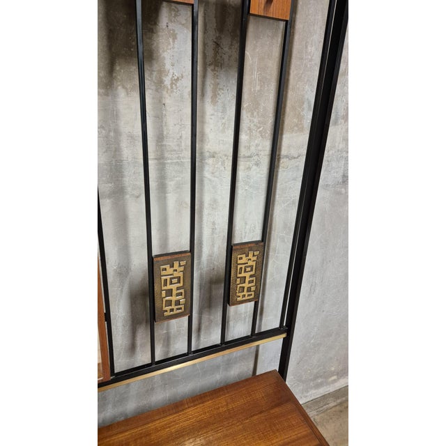 A distinctive vintage hallway coat rack attributed to Alfred Hendrickx for Belform, Belgium. Combining warm-toned wood...