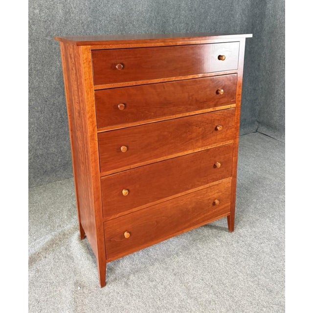 This 5-drawer cherry chest by The Woodshed showcases clean, timeless lines with a warm, richly grained finish and simple...