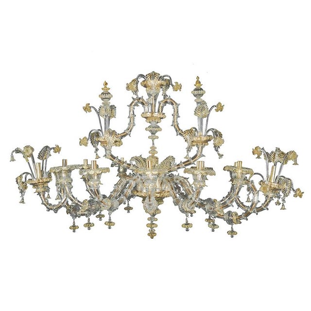 Boat chandelier in transparent Murano glass, forged with ancient lace workmanship and gold details. System with 12 lights...