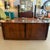This Scandinavian Modern modern, rosewood sideboard, credenza was made in Denmark circa 1960s. The credenza sits on a...