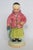 This amazing Asian Boy with Fish Figurine is made out of ceramic. This lovely piece was designed by art potter Brad Keeler...