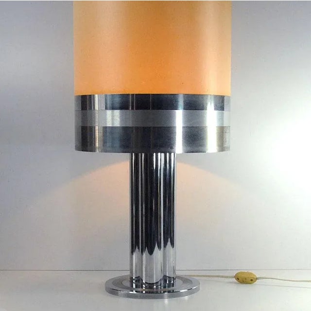 A large very effective table lamp whose base is made of massive chrome metal. It comes from Italy from the 1970s. It is...