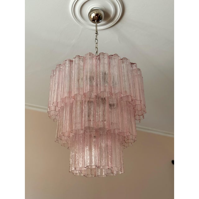 Pair of bold eclectic pink classic murano chandeliers. Tubular tronchi formed glass prisms in traditional italian mid-...