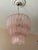 Pair of bold eclectic pink classic murano chandeliers. Tubular tronchi formed glass prisms in traditional italian mid-...