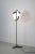 - Floor lamp made in Italy, 1960s - With four opaline glass shades - A painted metal stem with teak and brass accents...