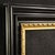 Mid-20th-century Italian frame. Beautifully ebonized and gilded wood cabinet with attractive lines and furnishings. The...