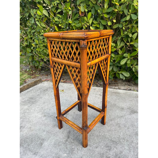 Crafted from burnt split bamboo with woven rattan and wood, this vintage pedestal features an open lattice design, woven...