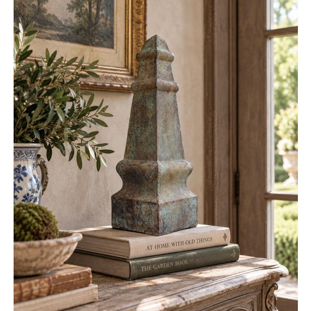 A beautifully proportioned vintage metal garden finial or obelisk. The sculptural silhouette and pattern detail give the...