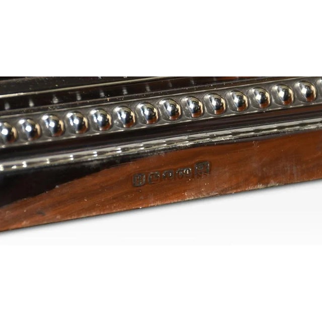 Silverplate table lamp, having a Corinthian column on a square stepped base. The lamp has been rewired. Dimensions Height...