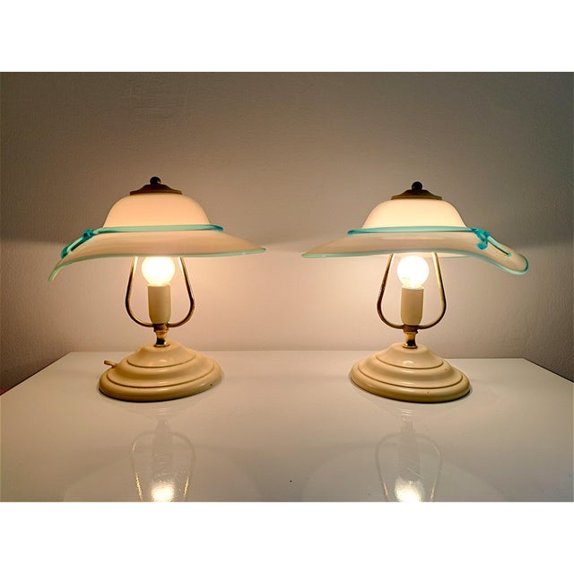 Pair of murano glass table lamps, made in italy, vintage from the 1980s. the lamps have an original and playful design,...