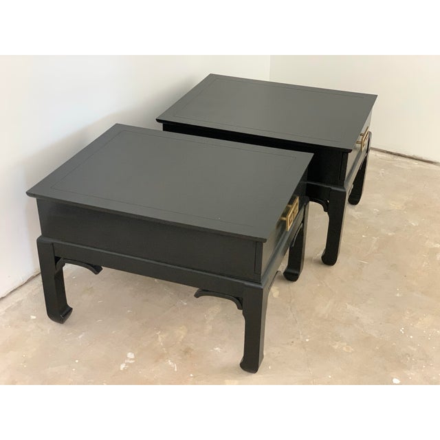 A pair of vintage chinoiserie side tables with Ming style legs. These mid-century beauties have a large drawer for smalls...