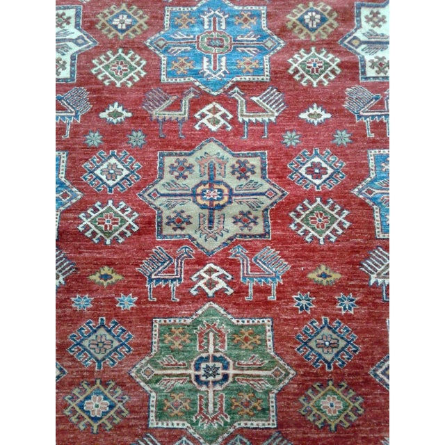 This particular Hand Knotted Fine Rug is made of 75% wool & 25% cotton, dyed with pigment from vegetables. This piece has...
