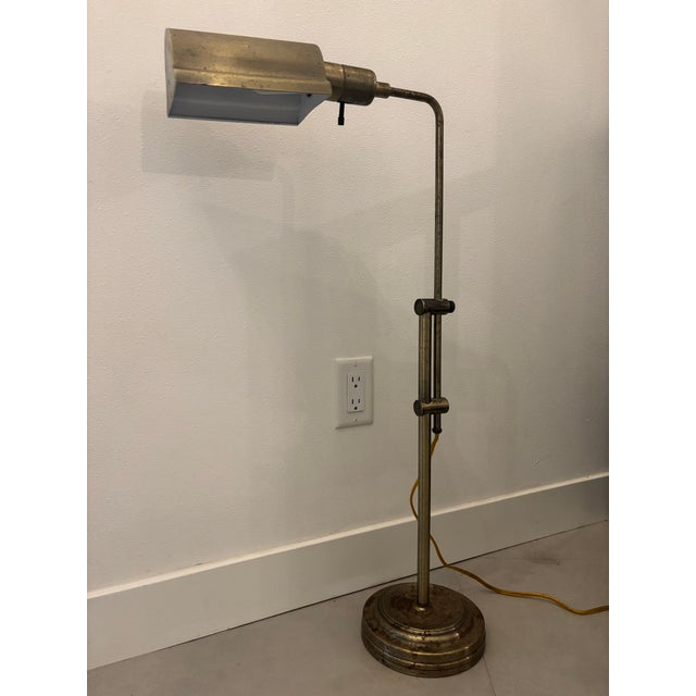 Vintage adjustable brass pharmacy-style floor lamp featuring a streamlined rectangular metal shade, telescoping height...
