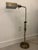Vintage adjustable brass pharmacy-style floor lamp featuring a streamlined rectangular metal shade, telescoping height...