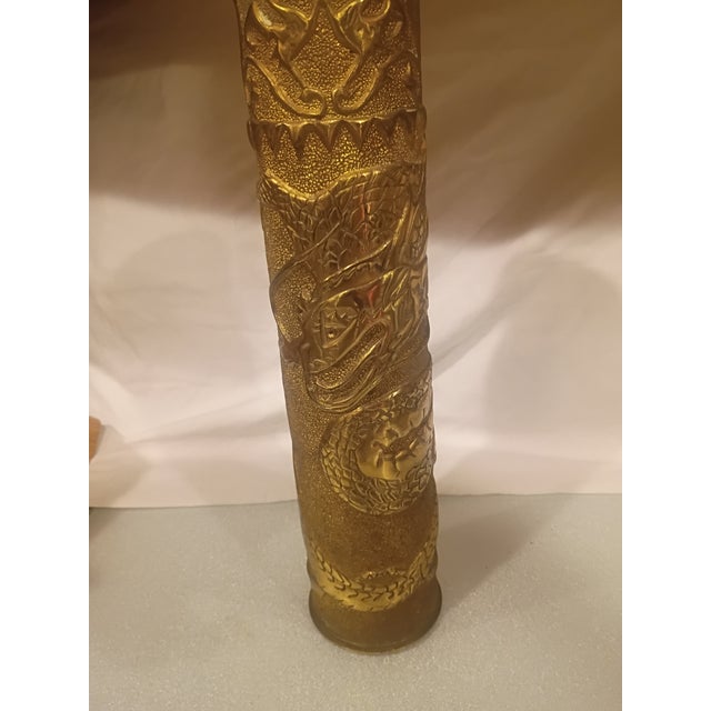 An extraordinary example of WWI Trench Art, this 1917-dated 75mm brass artillery shell has been painstakingly hand-...