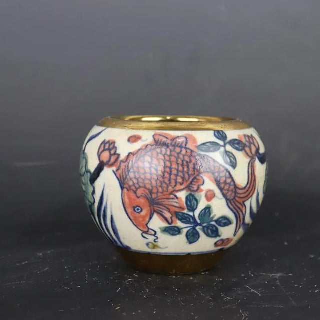 H-8.6cm,W-11cm This Yellow Ground Famille Rose Porcelain Tea Jar is a vintage piece hand-painted with vibrant yellow...