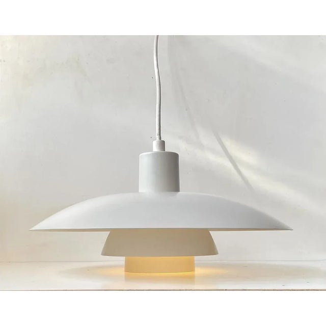 -a matching pair of tiered ceiling lights - produced in denmark circa 1980 -designed by poul henningsen - ph -manufactured...