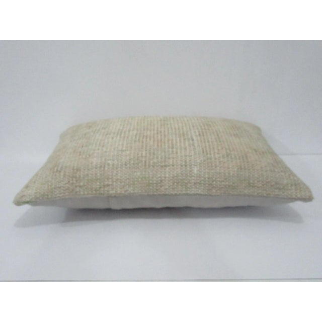 Decorative pillow cover made from a vintage Turkish handknotted rug. Backed with good quality cotton fabric. Pillow...